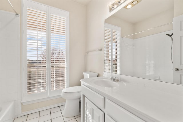 full bath featuring a wealth of natural light, tile patterned flooring, vanity, and toilet