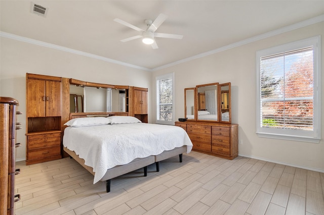 bedroom with ceiling fan, visible vents, light wood-style floors, baseboards, and ornamental molding