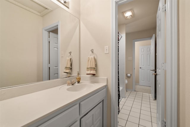 full bath with tile patterned flooring, walk in shower, and vanity