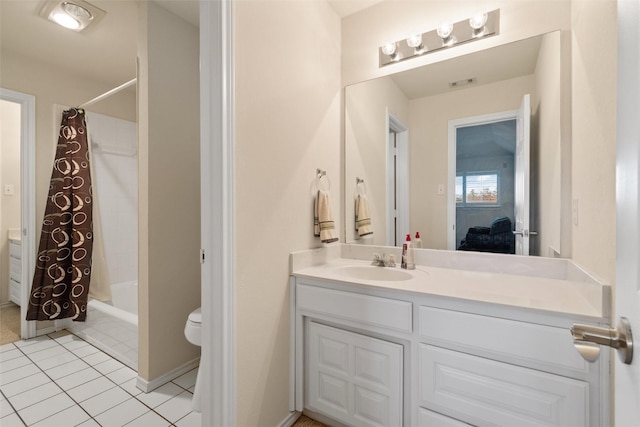 bathroom featuring toilet, tile patterned flooring, visible vents, and vanity