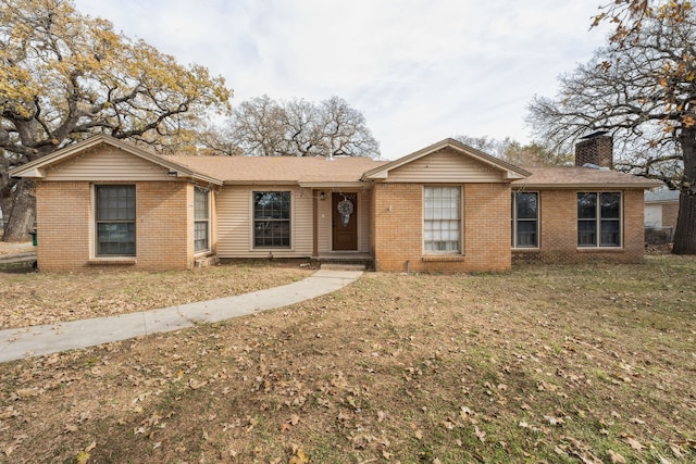 ranch-style home with a front yard