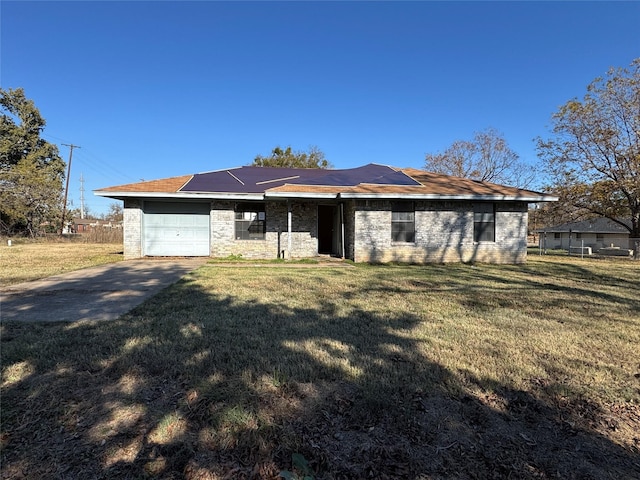 ranch-style home featuring a front yard and a garage