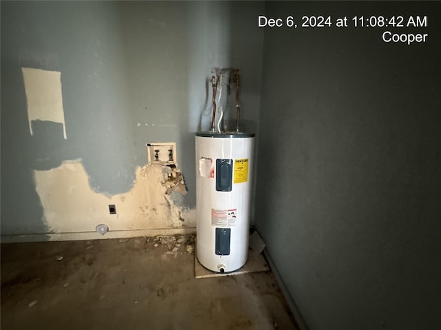 utility room featuring water heater