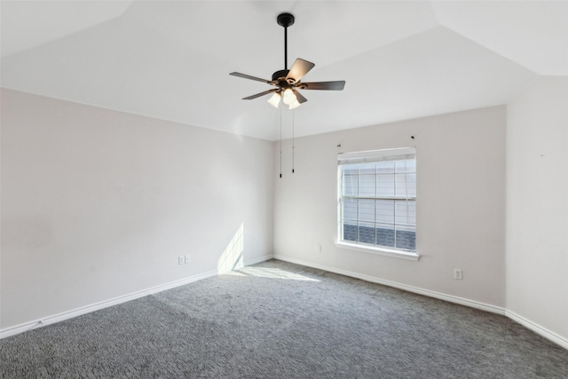 empty room featuring dark hardwood / wood-style floors, ceiling fan, and lofted ceiling