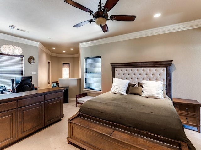 carpeted bedroom with ceiling fan and crown molding