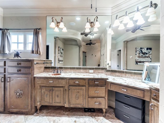 bathroom with ceiling fan, vanity, and ornamental molding