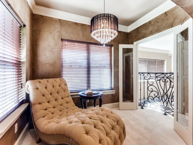 sitting room with a chandelier, a wealth of natural light, and french doors