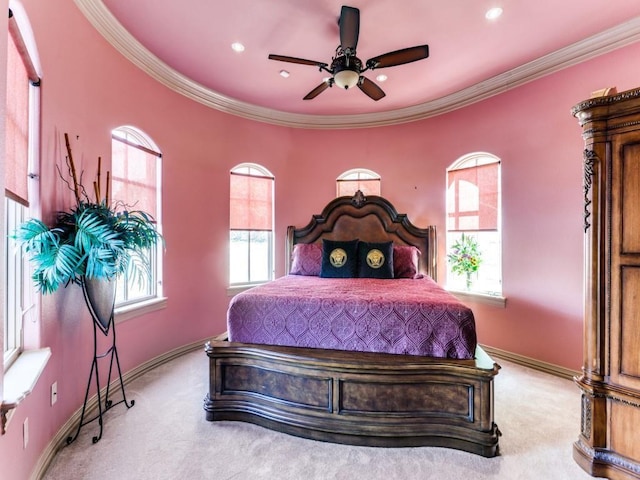 bedroom with light carpet, ceiling fan, and crown molding