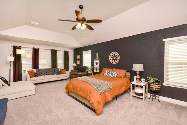 carpeted bedroom featuring vaulted ceiling and ceiling fan