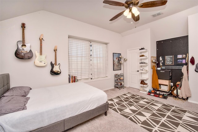 carpeted bedroom with ceiling fan and lofted ceiling