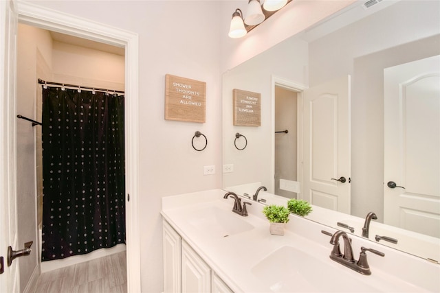 bathroom with vanity and a shower with shower curtain