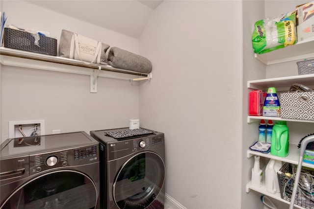 clothes washing area featuring washer and dryer