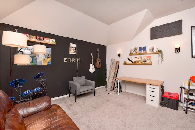 sitting room with vaulted ceiling and carpet flooring