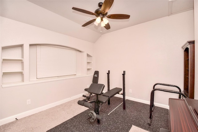 exercise area featuring built in shelves, vaulted ceiling, and ceiling fan