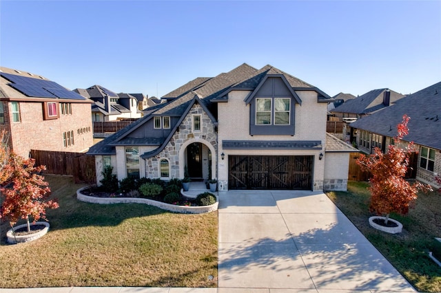 view of front of house featuring a garage and a front yard