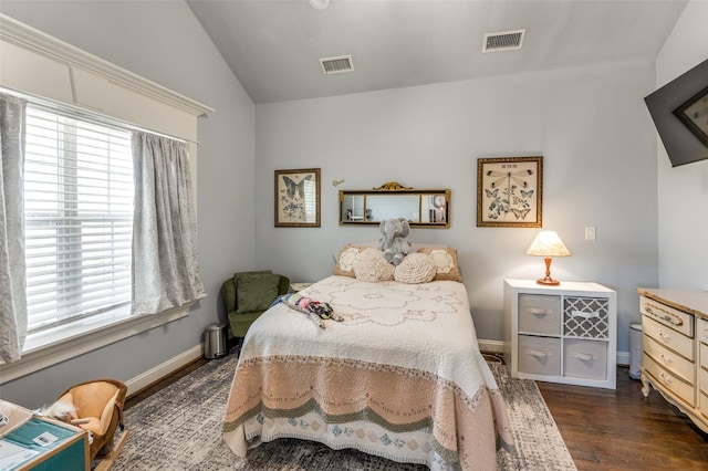 bedroom featuring dark wood-style flooring, multiple windows, and visible vents