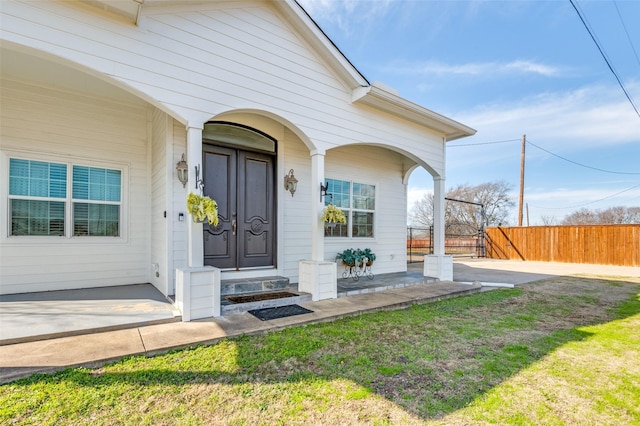 doorway to property with fence