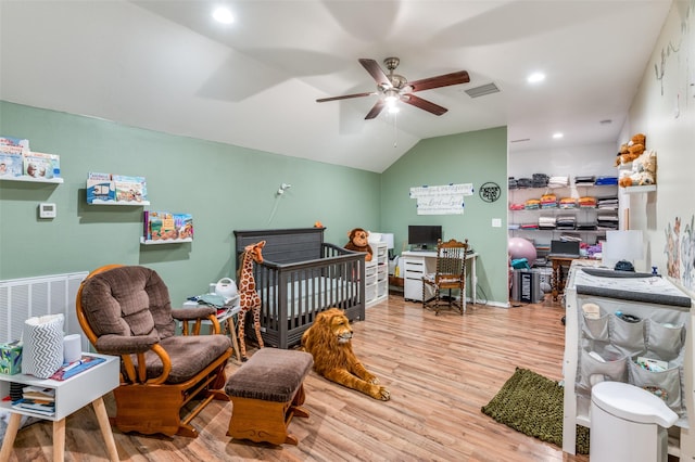 bedroom featuring lofted ceiling, recessed lighting, visible vents, wood finished floors, and baseboards