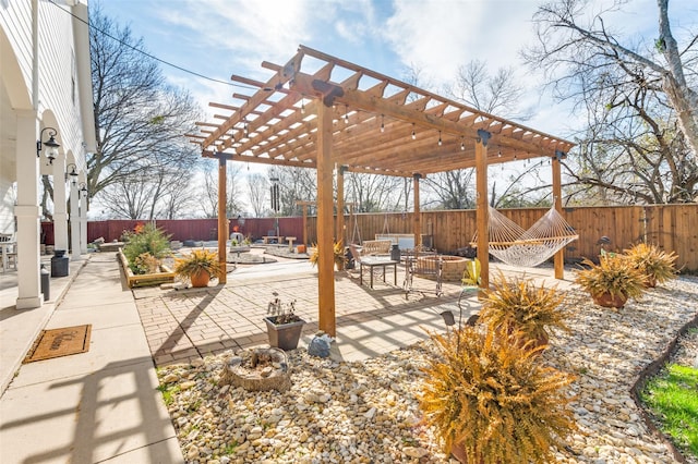 view of patio / terrace featuring a fire pit, a fenced backyard, and a pergola