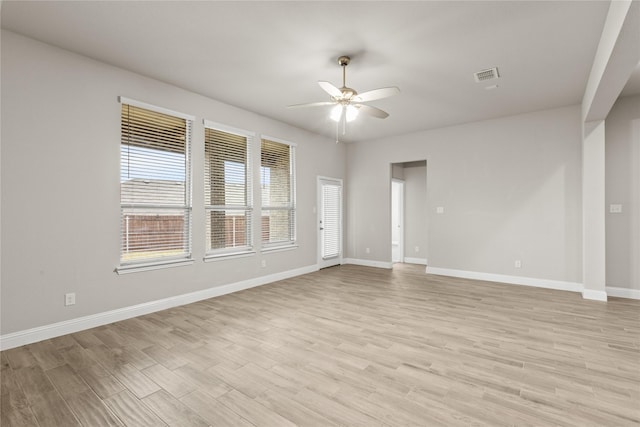 unfurnished room with ceiling fan and light hardwood / wood-style flooring