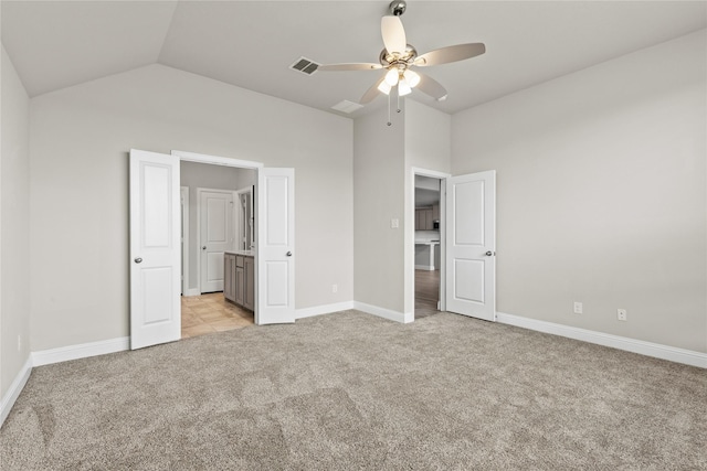 unfurnished bedroom with light colored carpet, ceiling fan, and lofted ceiling