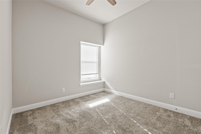 spare room featuring ceiling fan and carpet floors