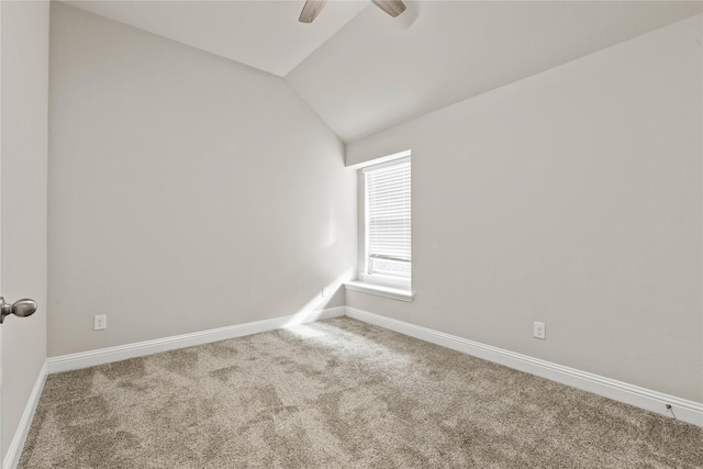 unfurnished room featuring ceiling fan, carpet, and lofted ceiling