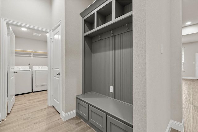 mudroom featuring washer and clothes dryer and light wood-type flooring