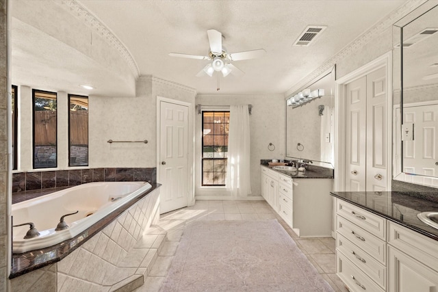 bathroom featuring vanity, a textured ceiling, tile patterned floors, and ceiling fan