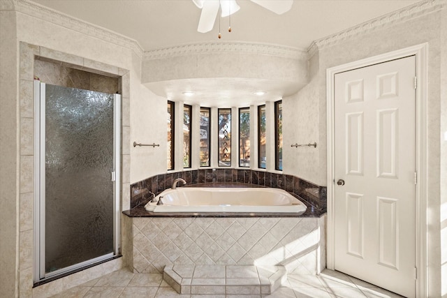 bathroom featuring plus walk in shower, tile patterned floors, ceiling fan, and ornamental molding