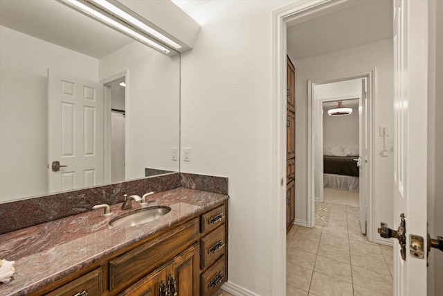 bathroom with tile patterned flooring and vanity