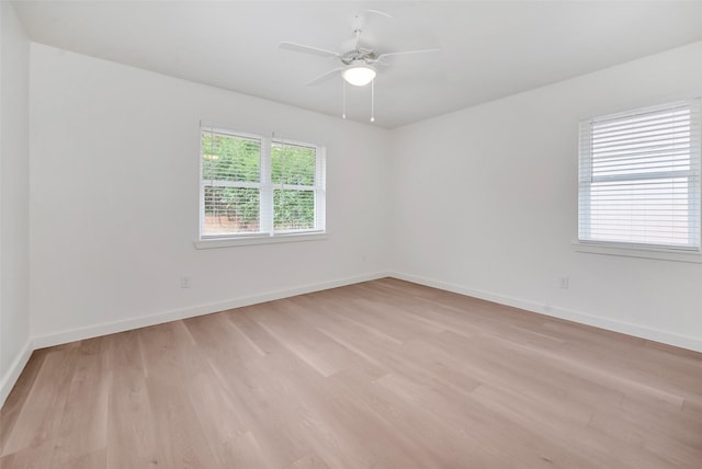 spare room featuring ceiling fan and light hardwood / wood-style flooring