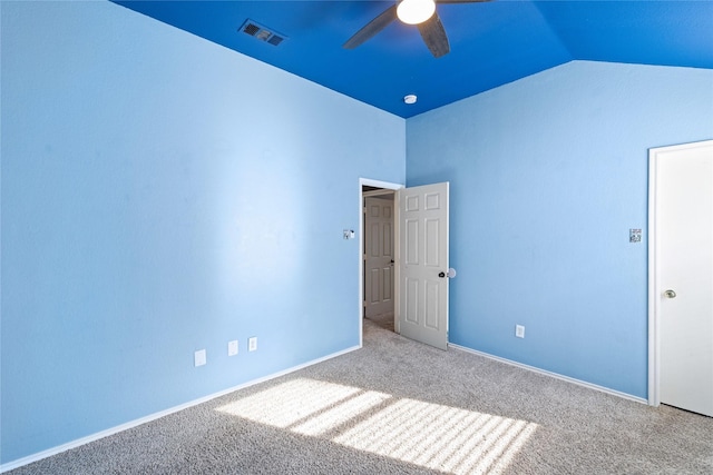 unfurnished bedroom with carpet flooring, ceiling fan, and lofted ceiling