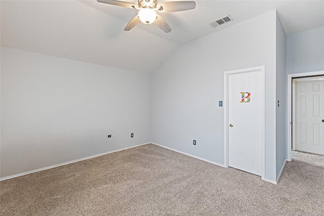 additional living space with light colored carpet, vaulted ceiling, and ceiling fan