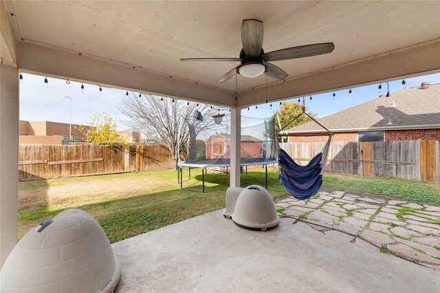 view of patio / terrace featuring ceiling fan and a trampoline