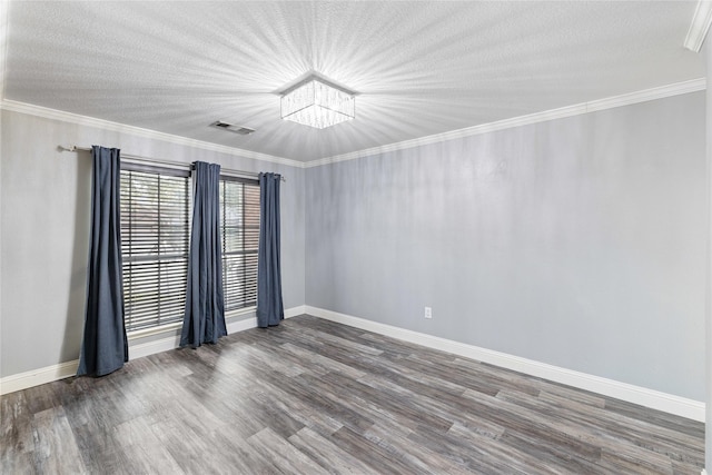 unfurnished room featuring crown molding, dark wood-type flooring, and a textured ceiling