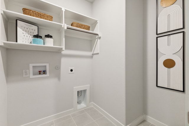 laundry area featuring hookup for a gas dryer, light tile patterned floors, washer hookup, and hookup for an electric dryer