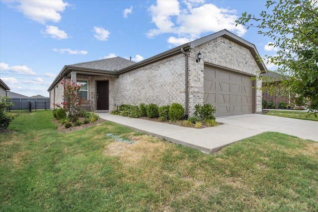 view of front of home with a garage and a front yard