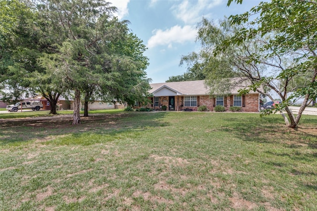 ranch-style house with a front lawn