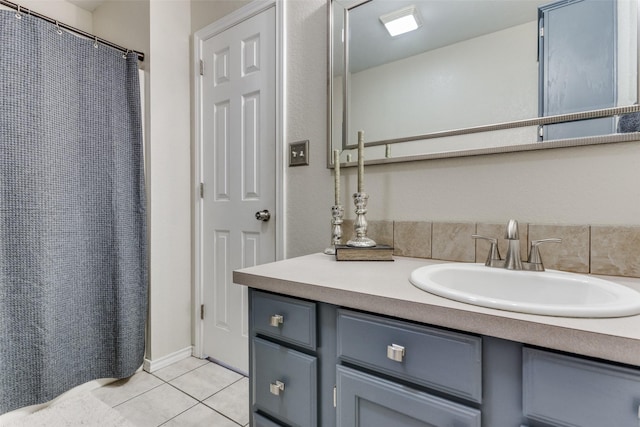 bathroom featuring tile patterned flooring and vanity