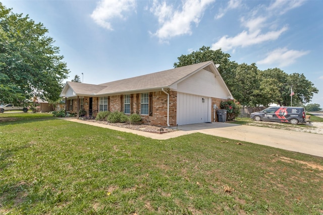 single story home with a garage and a front lawn