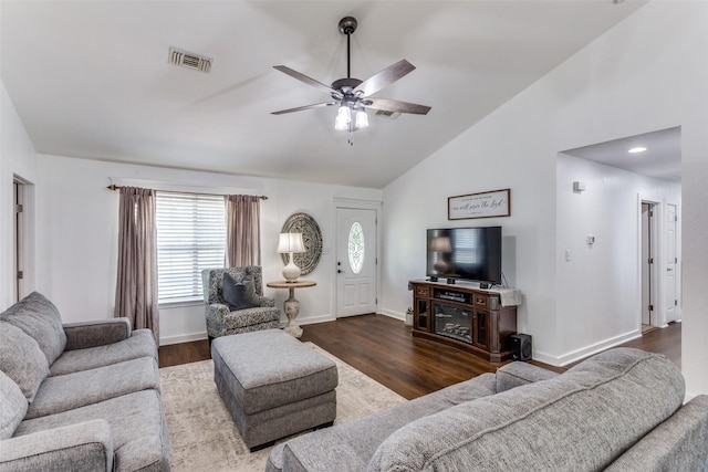 living room with dark hardwood / wood-style flooring, high vaulted ceiling, and ceiling fan