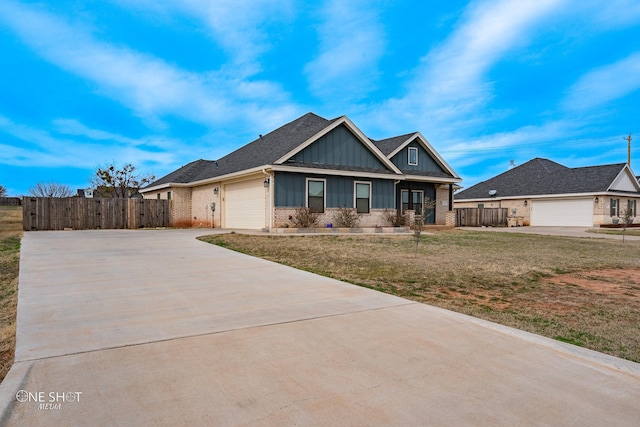 view of front facade with a garage and a front yard