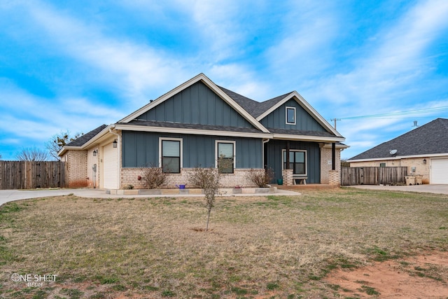 craftsman-style house with a front lawn and a garage