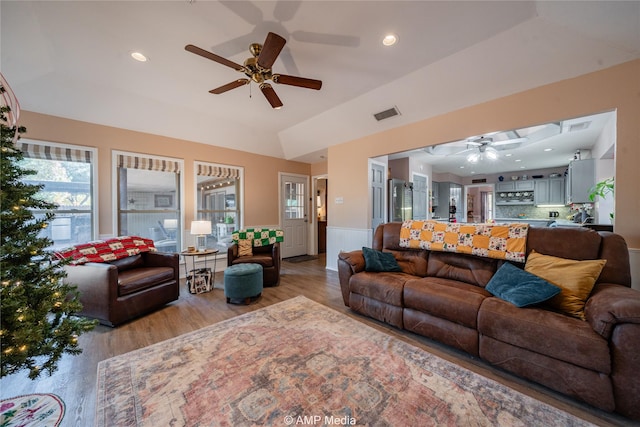 living room with ceiling fan and light wood-type flooring