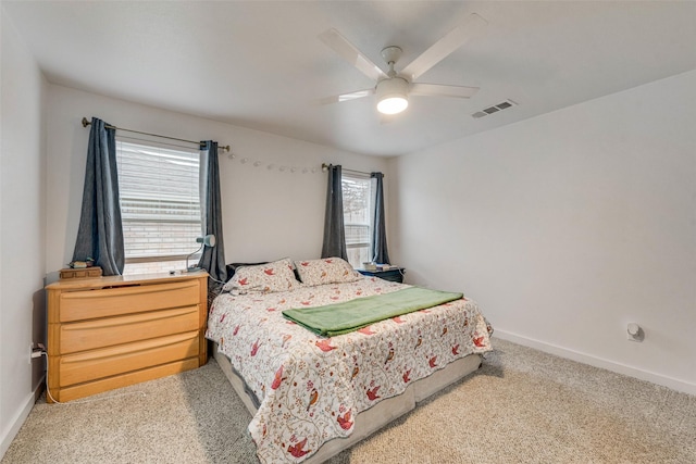 bedroom with light carpet and ceiling fan