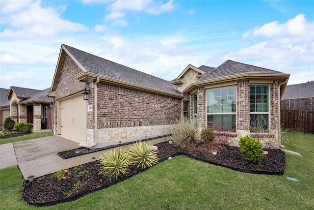 ranch-style home with a front lawn and a garage