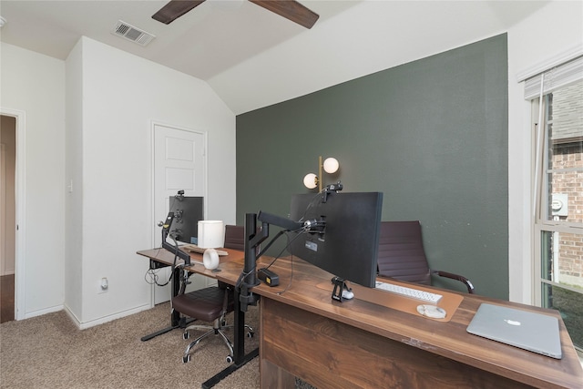 carpeted office featuring lofted ceiling