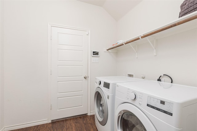 laundry area with independent washer and dryer and dark hardwood / wood-style floors