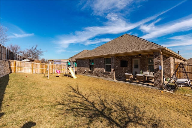 back of property featuring an outdoor hangout area, a patio area, a playground, and a lawn